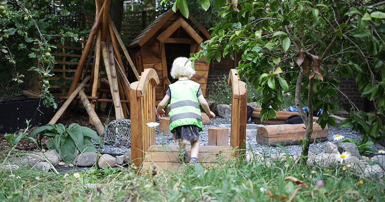 small child at minihome nursery in their nature garden